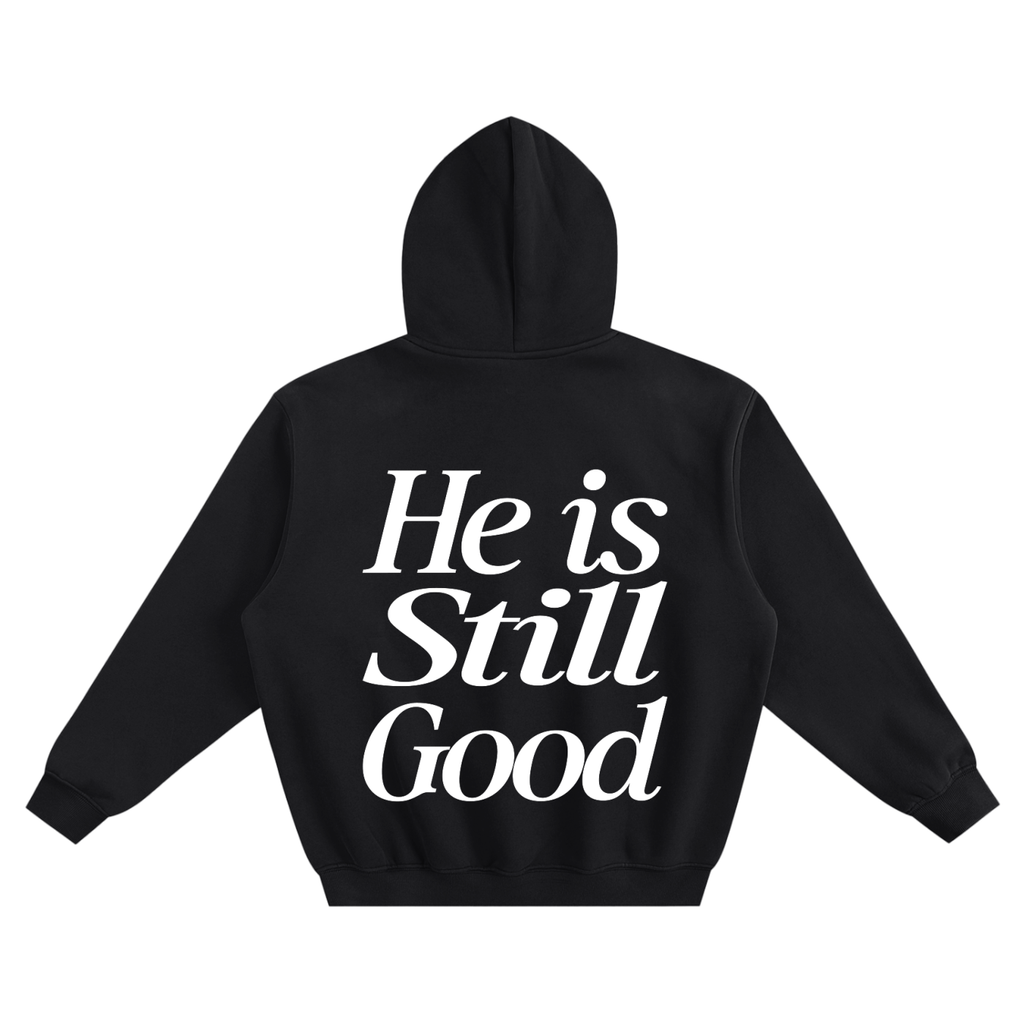 Black hoodie with 'He is Still Good' text on the back against a white background