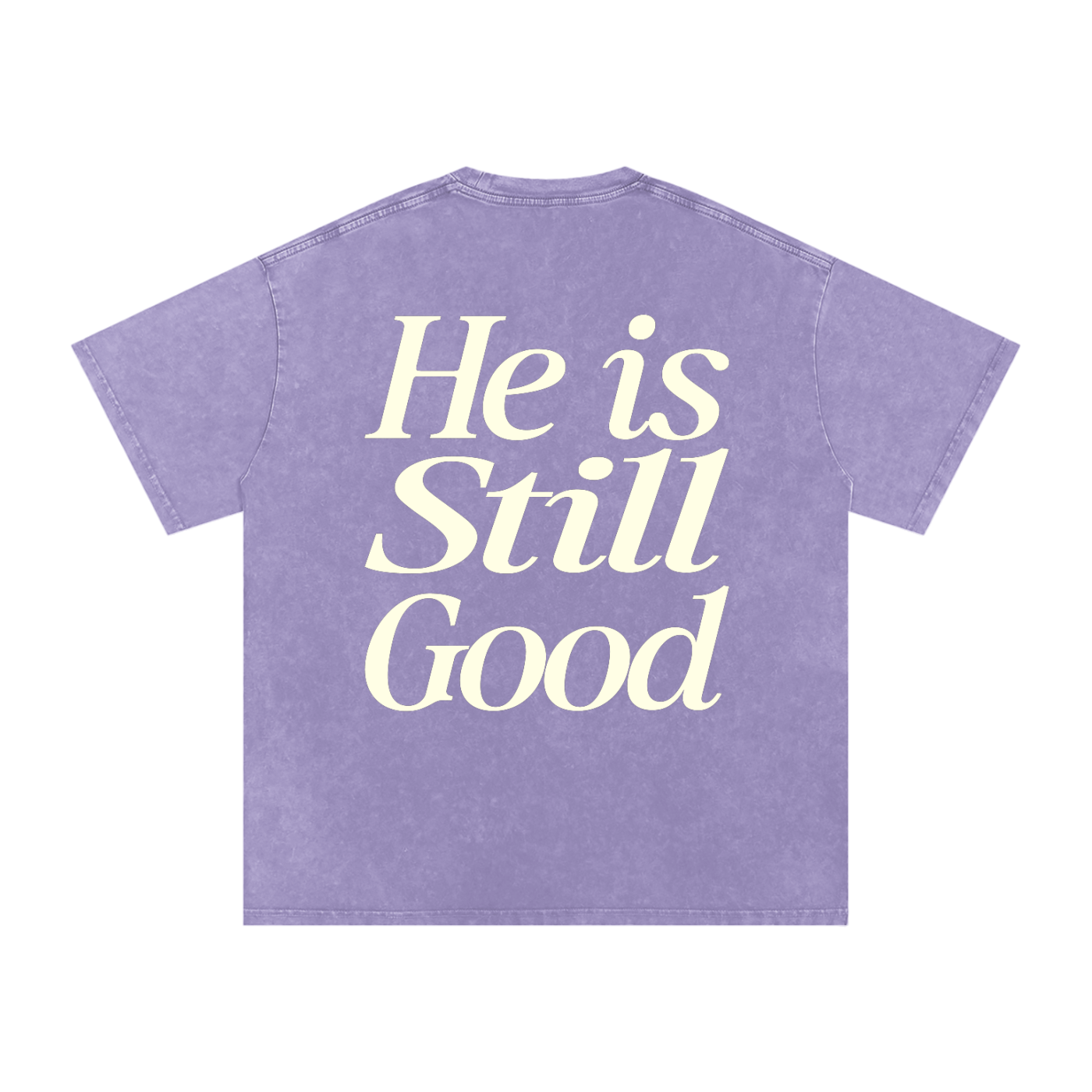 Purple t-shirt with 'He is Still Good' text on a white background